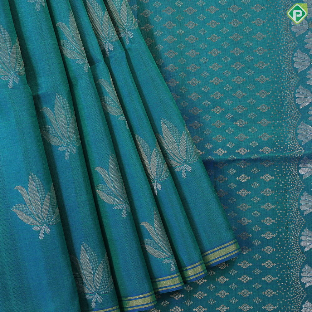 Peacock blue fancy lotus butta design self gold zari border grand pallu soft silk saree