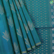 Peacock blue fancy lotus butta design self gold zari border grand pallu soft silk saree