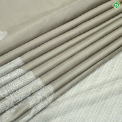 Beige Plain Body Silver Zari Elephant Border Trendy Designer Silk Saree