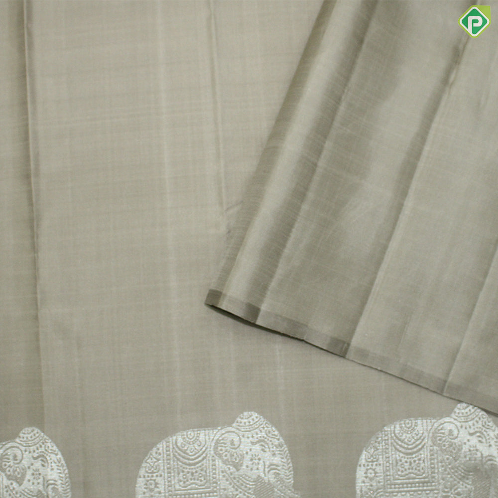 Beige Plain Body Silver Zari Elephant Border Trendy Designer Silk Saree