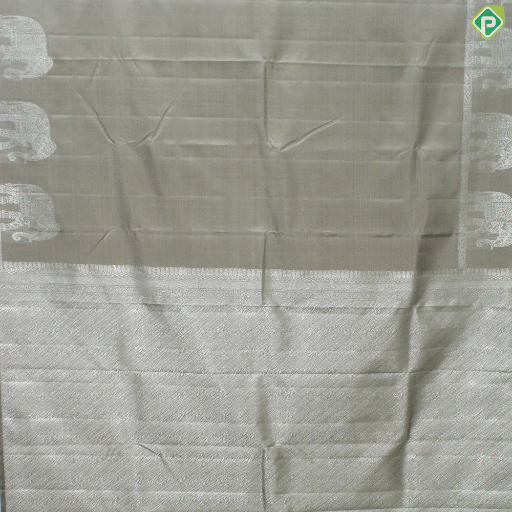 Beige Plain Body Silver Zari Elephant Border Trendy Designer Silk Saree