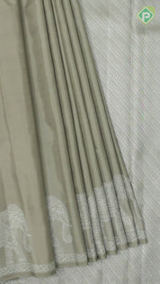 Beige Plain Body Silver Zari Elephant Border Trendy Designer Silk Saree