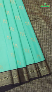 Spring green gold zari butta design contrast brown rangoli border gift saree