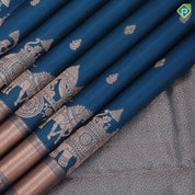 Teal blue copper zari small fancy butta design self copper zari cross lines yaanai ambari border silk saree