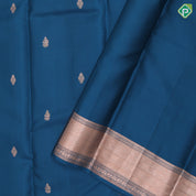 Teal blue copper zari small fancy butta design self copper zari cross lines yaanai ambari border silk saree
