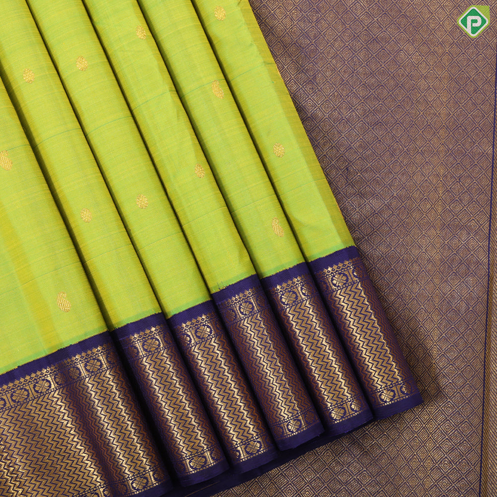 Lemon green gold zari mango butta design indigo blue with gold zari zig zag mid rettapet border traditional silk saree