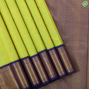 Lemon green gold zari mango butta design indigo blue with gold zari zig zag mid rettapet border traditional silk saree