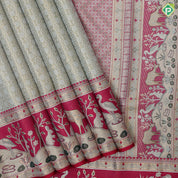 Mint green silver gold zari geometrical brocade design contrast rani pink gold zari wild effect pythonic design border grand tissue silk saree