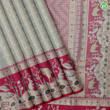 Mint green silver gold zari geometrical brocade design contrast rani pink gold zari wild effect pythonic design border grand tissue silk saree
