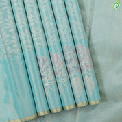 Sea green gold zari grand floral tissue weaved design self meena work floral border trendy tissue silk saree