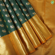 Pine Green peacock embossed butta design contrast mustard gold zari peacock butta border trendy silk saree