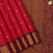 Rani pink gold zari peacock chakaram design purple wave border design traditional silk saree