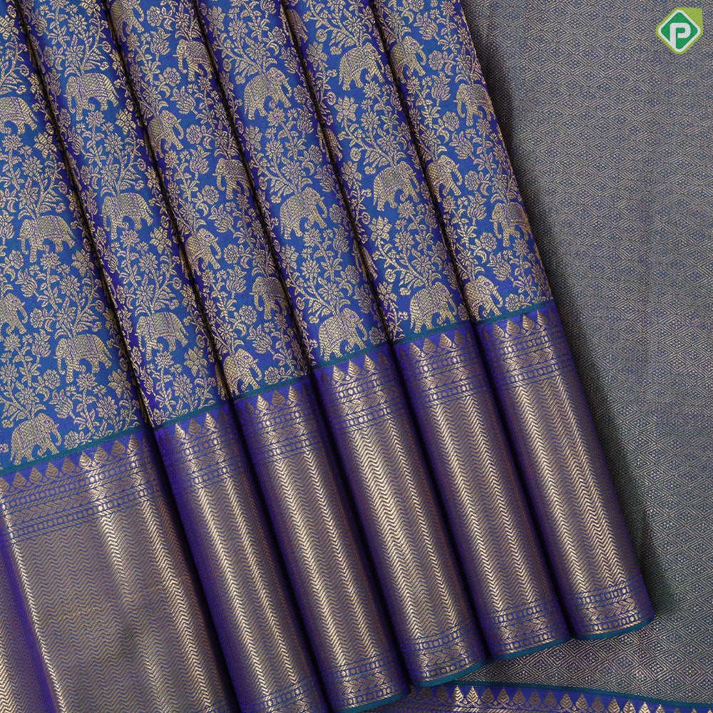 Peacock green gold zari elephant grand floral design self gold zari zig zag border grand bridal silk saree