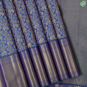 Peacock green gold zari elephant grand floral design self gold zari zig zag border grand bridal silk saree