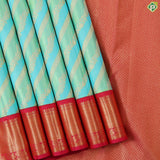 Pista green sky blue and gold zari cross lines design contrast pink gold zari border grand bridal silk saree