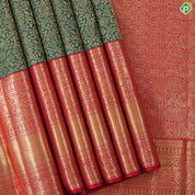 Dark green with gold zari grand floral design contrast maroon red gold zari border grand brocade bridal silk saree