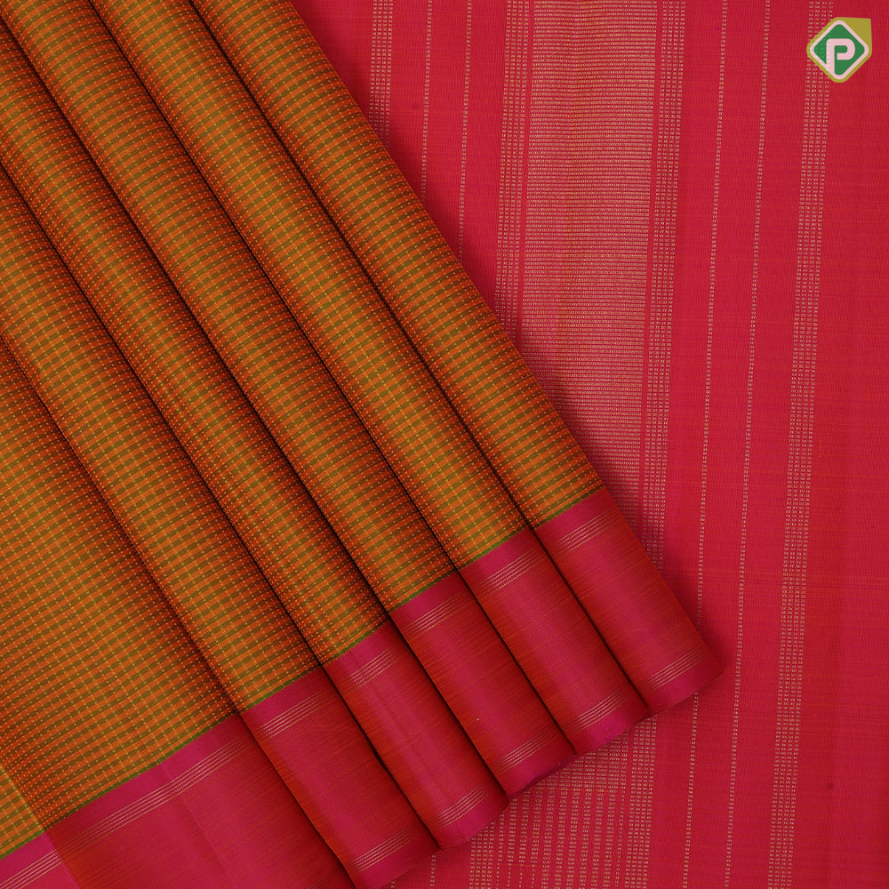 orangish yellow with leaf green lines and thread works design plain rose pink gold zari rettapettai border traditional retro silk saree