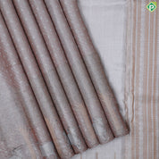 Dark peach silver zari zari by zari butta and shimmer design self cow and tree border master weaved pichwai silk saree