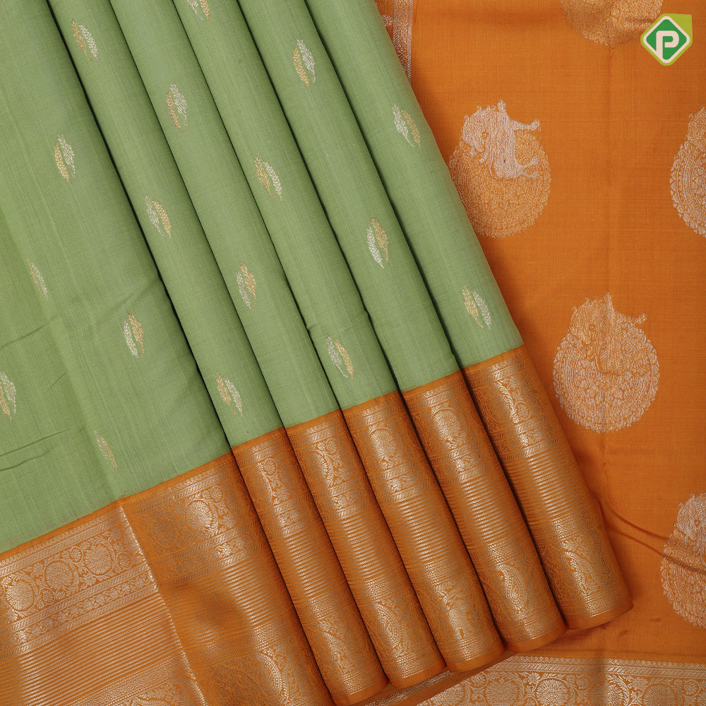Cardamon green silver gold zari double cone butta mustard yellow silver gold zari rangoli border traditional silk saree