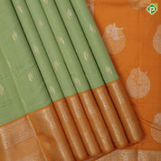 Cardamon green silver gold zari double cone butta mustard yellow silver gold zari rangoli border traditional silk saree
