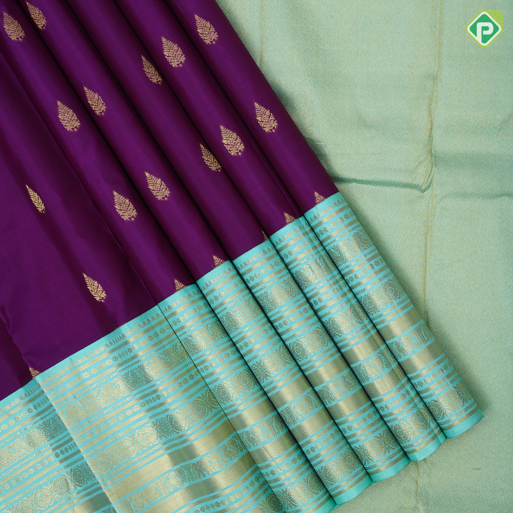 Purple gold zari leaf thilagam butta pista green gold zari multi designed lines border traditional silk saree