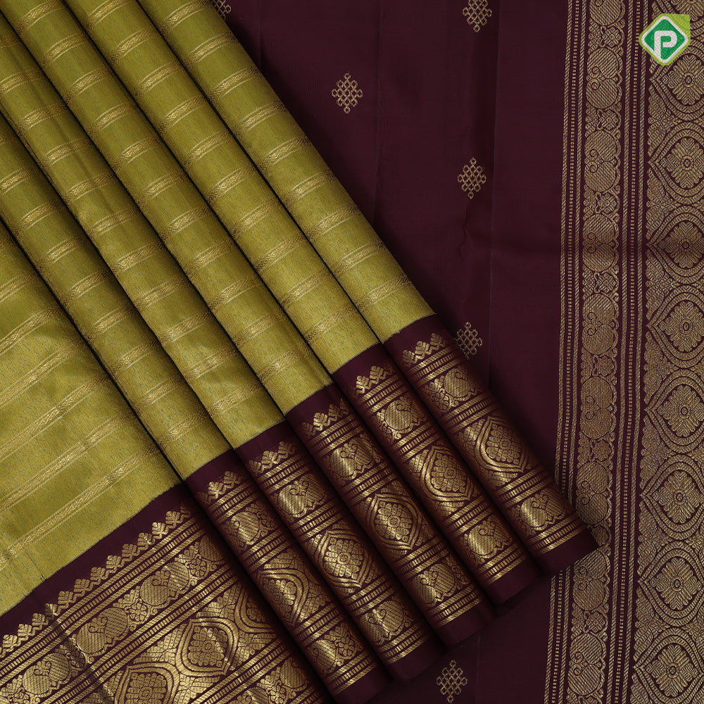 Mustard green gold zari rangoli lines design contrast syrup brown gold zari mango rangoli butta border traditional vintage silk saree
