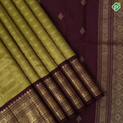 Mustard green gold zari rangoli lines design contrast syrup brown gold zari mango rangoli butta border traditional vintage silk saree
