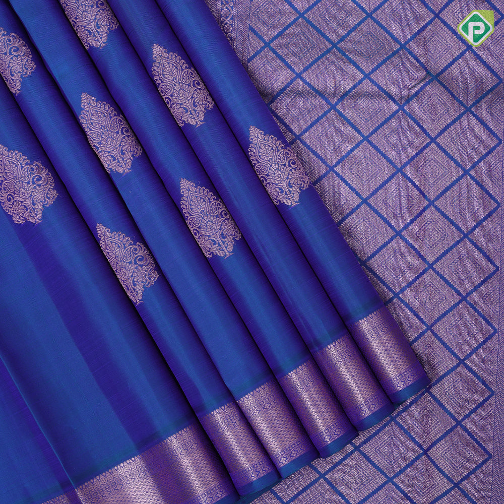 Peacock blue copper zari fancy thilagam butta design self color copper zari spinning edge border traditional silk saree