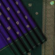 Indigo blue gold zari rudraksham annam butta motifs contrast green gold zari retta pett border traditional silk saree