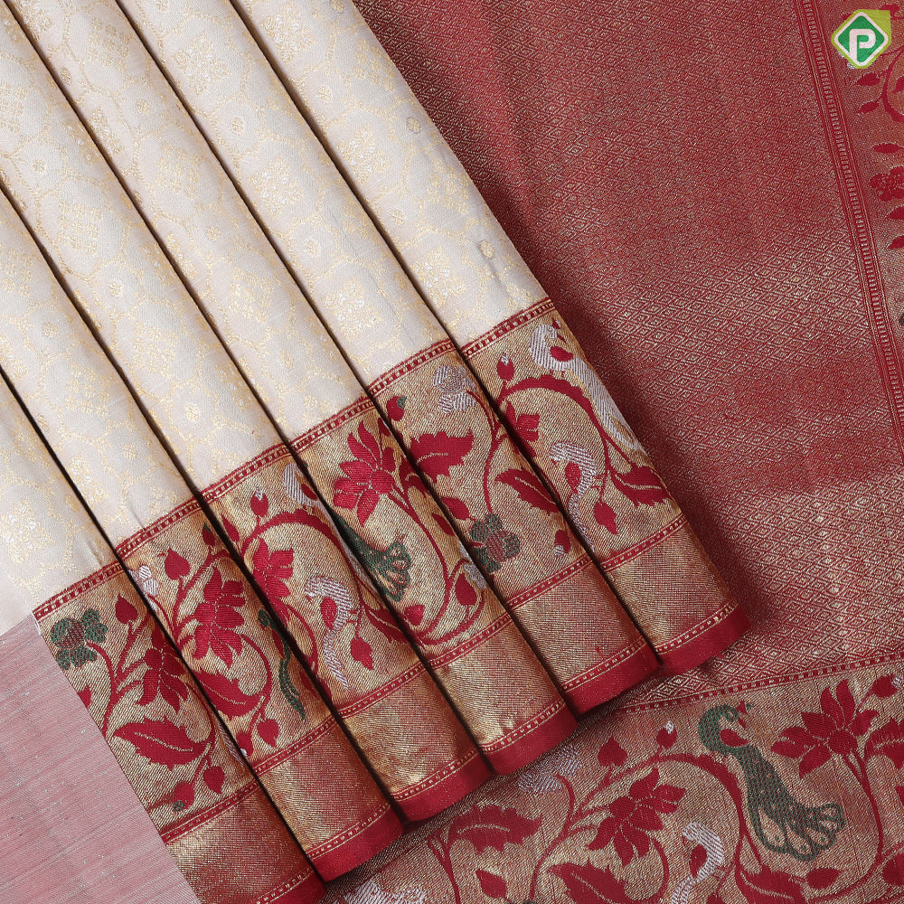 Creamy Sandal With Green Colour Pythonic Design Border Grand Bridal Silk Saree