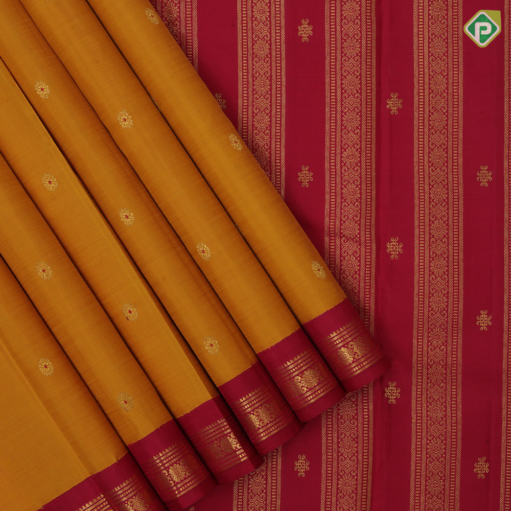 Mustard yellow chakaram design maroon flower border design traditional silk saree