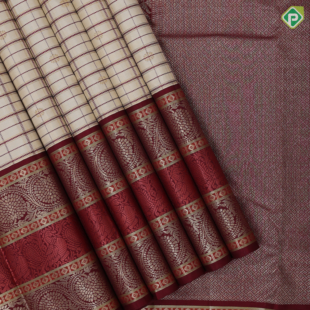 creamy sandal base maroon thread gold zari checks and butta maroon meena work border vintage traditional silk saree