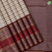 creamy sandal base maroon thread gold zari checks and butta maroon meena work border vintage traditional silk saree