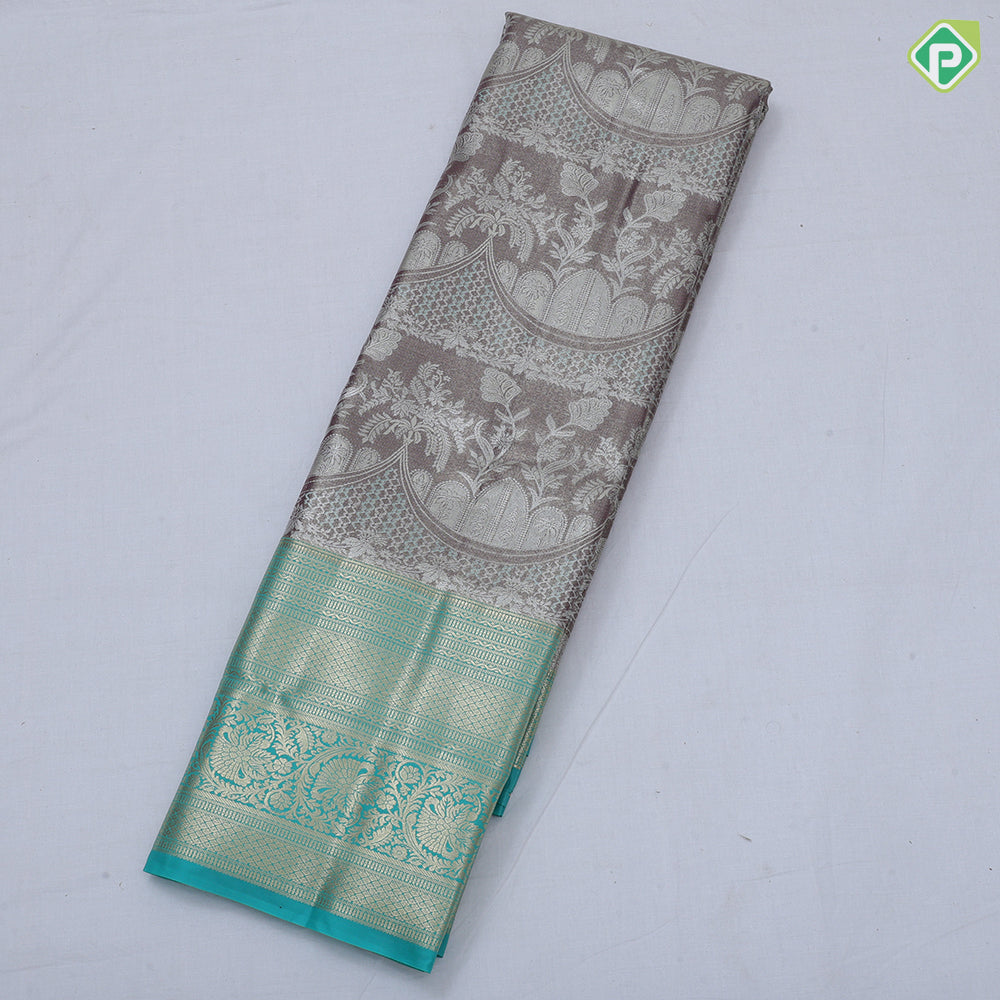 Pink silver zari fancy flower and arch design rama green gold zari rangoli border tissue art silk saree