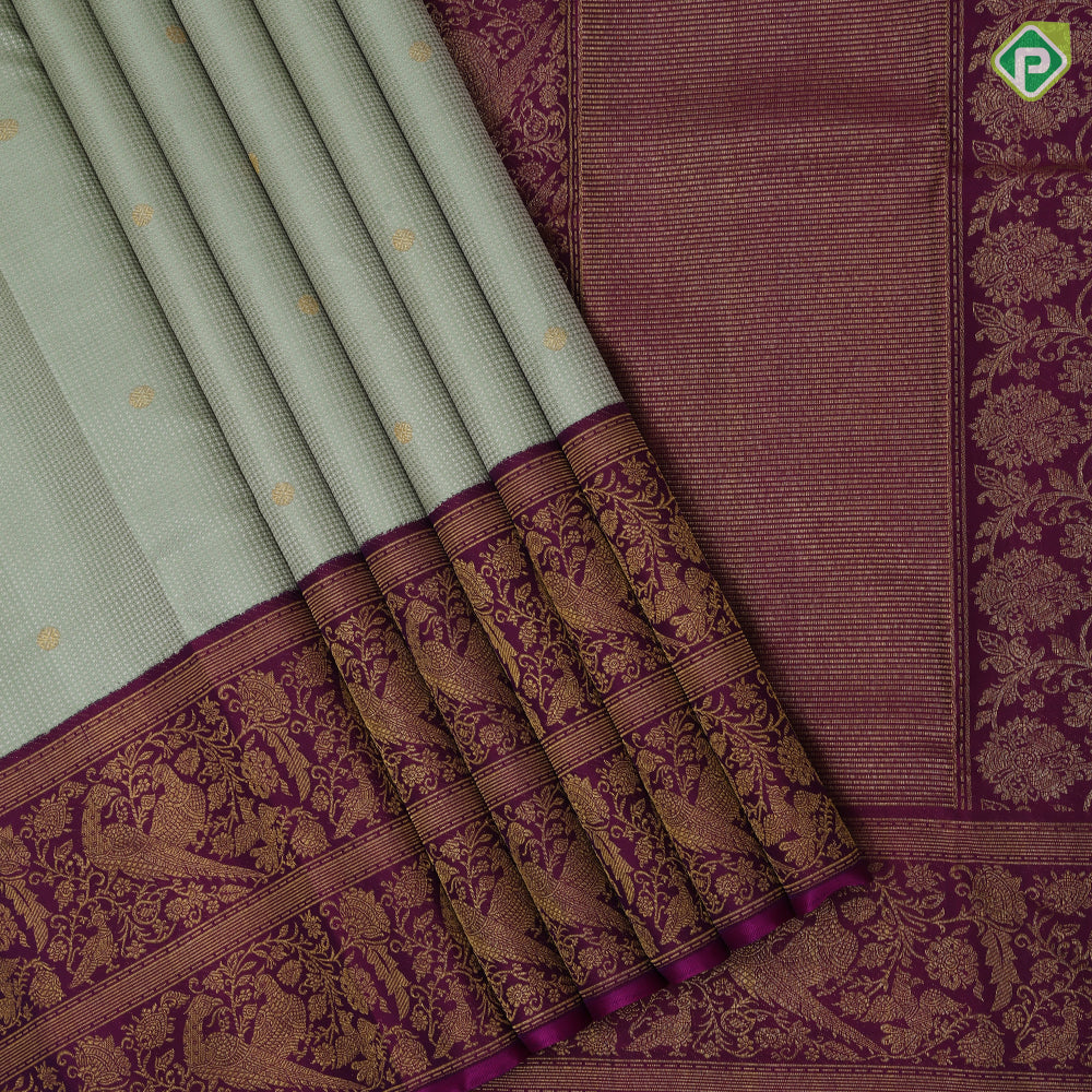 Pista green self designed stripes gold zari chakkaram butta contrast purple gold zari double peacock banaras style border fusion silk saree