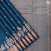 Teal blue copper zari small fancy butta design self copper zari cross lines yaanai ambari border silk saree