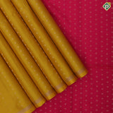 Mustard yellow gold zari dots lines self gold zari line border contrast pink gold zari dot pallu soft silk saree