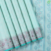 Suffire green silver zari zig zag waves design self multi color pythonic border grand bridal silk saree