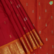 Tomato red gold zari fancy butta contrast mango yellow gold zari one side border silk saree