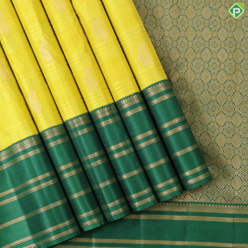 Lemon yellow with mango butta design dark green gold zari multi lines border Traditional silk saree