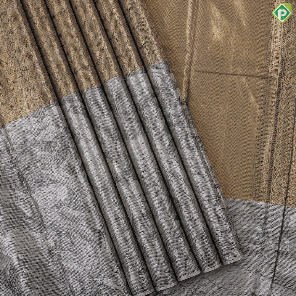 Golden yellow grand waves zari by zari weaved design Greyish self art effect scenery border trendy tissue silk saree