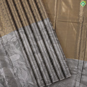 Golden yellow grand waves zari by zari weaved design Greyish self art effect scenery border trendy tissue silk saree