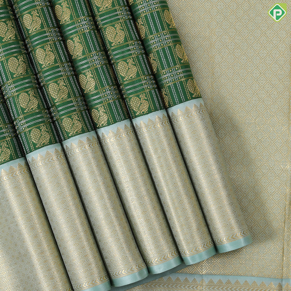 Dark green with peacock butta silver and gold zari checkered sea foam green border traditional silk saree
