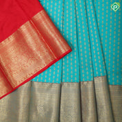 Peacock green gold zari fancy flower butta red gold zari fancy border pattu paavadai lehanka