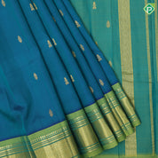 peacock blue gold zari fancy butta contrast green gold zari one side border silk saree