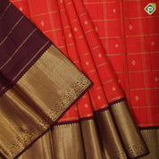 Rust orange gold zari checks and fancy butta brown gold zari particles design pattu paavadai lehanka