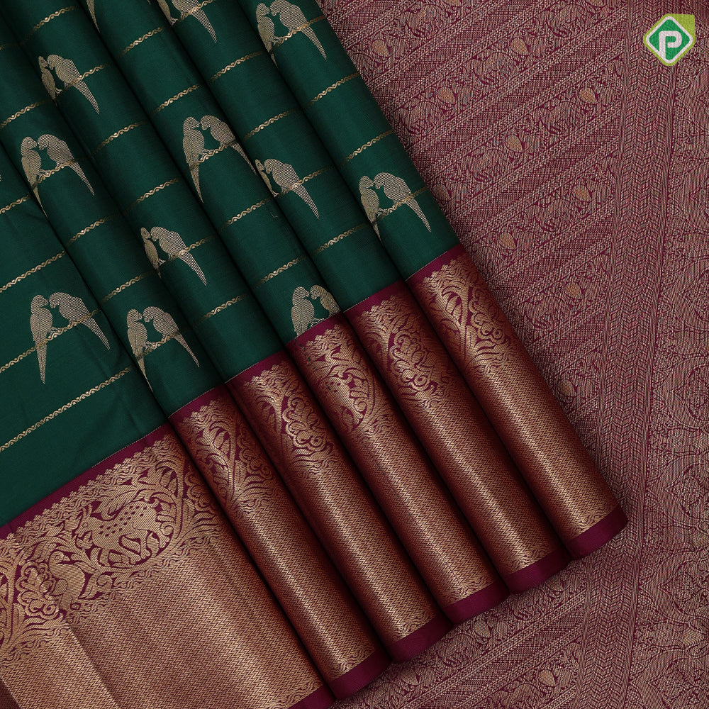 bottle green gold zari velthari lines double parrot butta purple gold zari vanasingaram border traditional silk saree