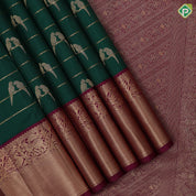 bottle green gold zari velthari lines double parrot butta purple gold zari vanasingaram border traditional silk saree