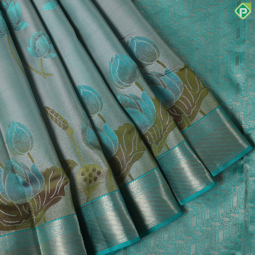 greyish green lotus flower embossed design peacock green gold zari border trendy silk saree