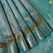 greyish green lotus flower embossed design peacock green gold zari border trendy silk saree